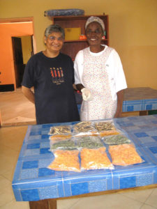 Sister Brigit and Margaret withpackaged dried food.